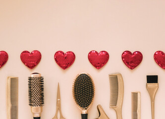 Valentines day template with hairdressing tools and hearts. Gold hair salon accessories on a light...