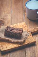 Fototapeta na wymiar Piece of chocolate cake on a wooden table.