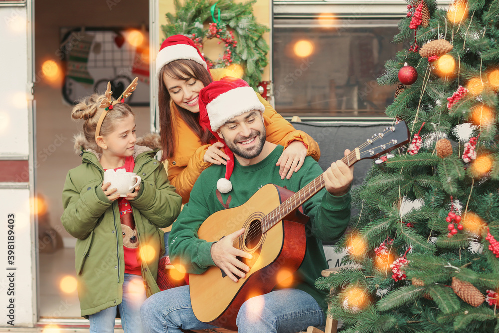 Sticker happy family with guitar outdoors on christmas eve