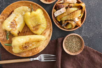 Bowl with roasted  pepper and chicken on dark background