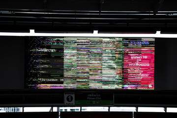 LED advertisement panel screen damaged, distortion image. Front view.