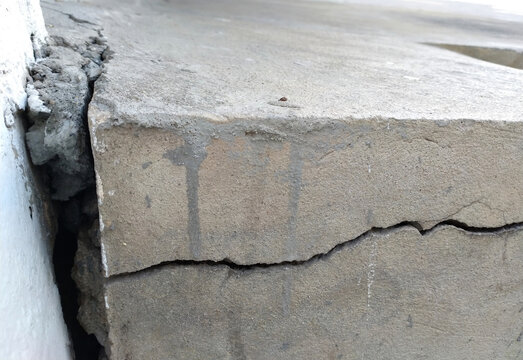 Crack cement concrete in pavement.