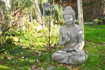 buddha statue in calm rest posing sitting in meditation pose