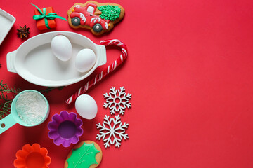 Ingredients for Christmas bakery and kitchen utensils on color background