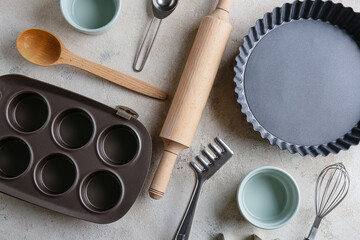 Set of kitchen utensils for bakery on grey background