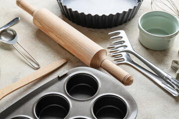 Set of kitchen utensils for bakery on grey background