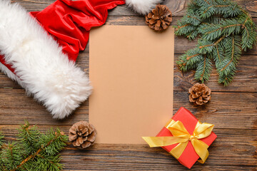 Blank paper for letter to Santa and Christmas decor on wooden background