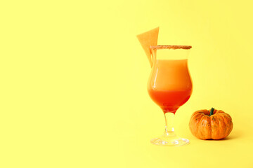 Glass of tasty pumpkin pie martini on color background