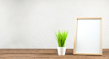Empty photo frame. Pot. Memory of the victims. On a wooden background