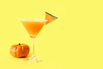 Glass of tasty pumpkin pie martini on color background