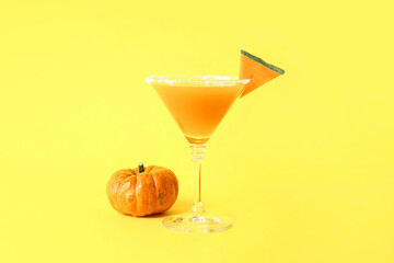 Glass of tasty pumpkin pie martini on color background