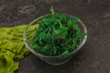 Green Chuka Seaweed Salad Isolated on White Background Top View. Wakame Sea Kelp Salat
