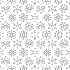 Winter seamless pattern with silver grey snowflakes on white background. New Year backdrop.