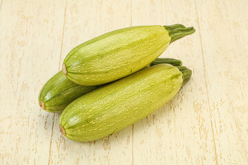 Young tasty zucchini over board