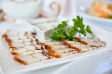 Lard and sliced bacon with mustard and horseradish. Close-up, selective focus