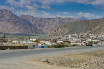 Panorama view of high-altitude Murghab town with mountain background on the Pamir Highway in Gorno-Badakshan, Tajikistan