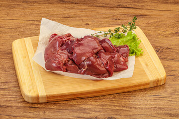Raw chicken liver over board
