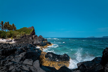 Tropical beach with suny views and waves, rocks and sand background. Travel destinations in Ly Son island, Vietnam  and banner web.