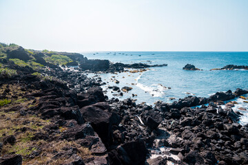 Tropical beach with suny views and waves, rocks and sand background. Travel destinations in Ly Son...