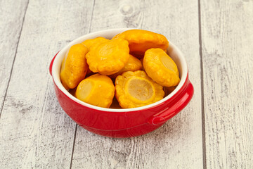 Marinated yellow patisson in the bowl