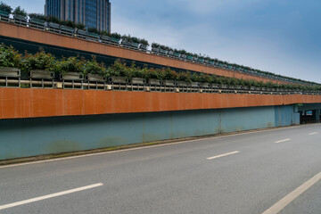 Concrete structure and asphalt road space under the overpass in the city