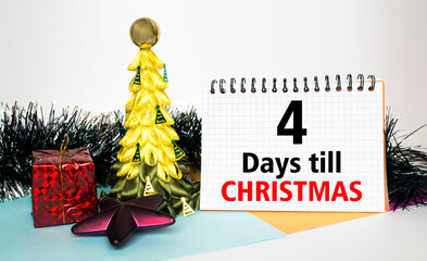 Christmas tree decorated with toys and tinsel, gift boxes and Notepad with text 4 Days till...