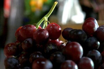 Healthy fruits Red wine grapes background/ dark grapes/ blue grapes/wine grapes,Red wine grapes background/dark grapes,blue grapes,Red Grape in a supermarket local market bunch of grapes ready to eat
