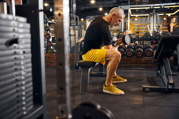 Serious bodybuilder working out at the gym