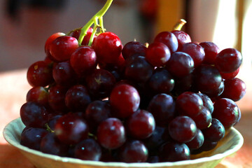 Healthy fruits Red wine grapes background/ dark grapes/ blue grapes/wine grapes,Red wine grapes background/dark grapes,blue grapes,Red Grape in a supermarket local market bunch of grapes ready to eat