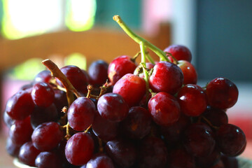 Healthy fruits Red wine grapes background/ dark grapes/ blue grapes/wine grapes,Red wine grapes background/dark grapes,blue grapes,Red Grape in a supermarket local market bunch of grapes ready to eat