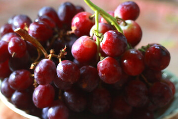 Healthy fruits Red wine grapes background/ dark grapes/ blue grapes/wine grapes,Red wine grapes background/dark grapes,blue grapes,Red Grape in a supermarket local market bunch of grapes ready to eat