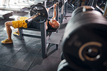Bodybuilder doing an upper body weight training exercise