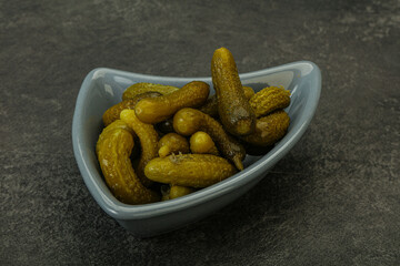 Pickled gherkin in the bowl