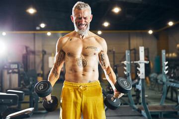 Energetic trainer doing a strength training exercise