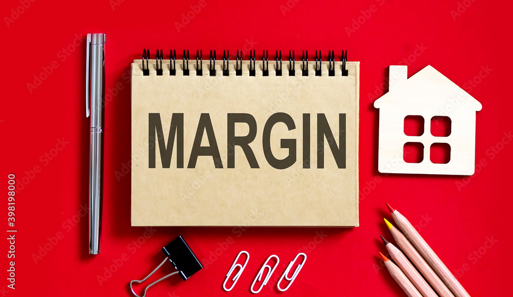 Poster margin text written on a notebook with pencils and office tools and model wooden house