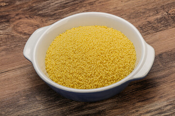 Raw cous cous heap in the bowl
