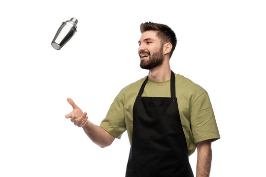 alcohol drinks, people and job concept - happy smiling barman with shaker preparing cocktail over white background