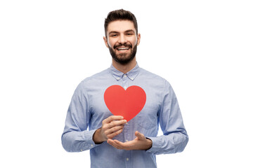 romance, love and people concept - happy smiling young man with red heart over white background