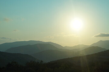 The sun rises over the mountains, sunrise in Crete. Greece.