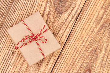Christmas or New Year gift box on wooden surface