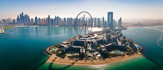 Ain Dubai ferris wheel on Bluewaters island with amazing Dubai skyline in the UAE