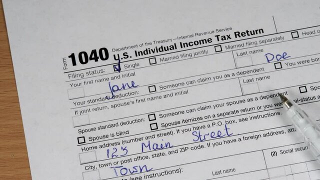 Blank Form 1040 U.S. Individual Income Tax Return with Pen. Tax Payment Concept. Filing Taxes Document