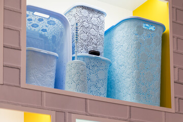 Assortment of Plastic Containers for Storing Things and Organizing Home Space and Interior Decor, Laundry Baskets, Boxes, Garbage Bucket, Household Goods for Sale in the Store on the Shelf Retail