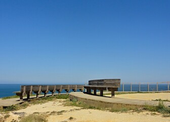 Fototapeta na wymiar Bench on the Atlantic coast in Foz de Arelho 