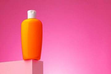 Skincare beauty products container against pink background