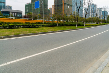 Fototapeta na wymiar Empty urban road and buildings in China
