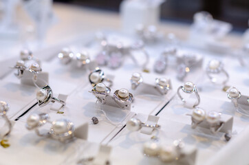 Luxury rings and earrings for sale in the jewelry store.