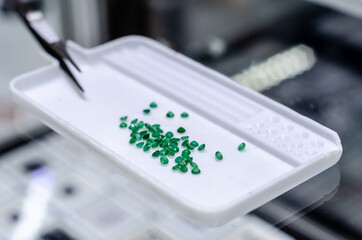 Faceted emerald gemstone for sale in the jewelry store.