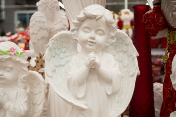 Christmas dreaming angel, close up. porcelain figurine of cupid