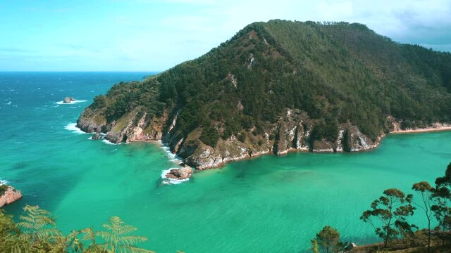 bay of Pech&oacute;n in Cantabria Spain. Turquoise waters of white sand on a sunny day. Small waves.